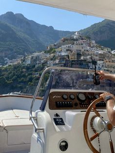 a man driving a boat in the ocean