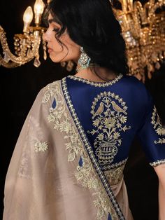 This stunning beige sequin saree drapes beautifully, adorned with delicate embroidery for a touch of modern glamour. The contrasting navy blue blouse adds a sophisticated edge. it's ideal for weddings, parties, or any special occasion. SAREE SPECIFICATIONS:Fabric: FancyColour: Beige Work Type: Sequins Embroidered BLOUSE SPECIFICATIONS:Fabric: FancyColour: Navy BlueWork Type: Sequins EmbroideredStitching Type: Un-Stitched SET CONTAIN:Saree With Blouse Piece In The Box: 1 Saree :: 1 Blouse Piece,Saree : 5.50Mtr :: Blouse Piece: 0.80Mtr LEGAL DESCRIPTION:There Might Be Minor Colour Variation Between the Actual Product And the Image Shown On Screen Due To Lighting in the Photography. Shimmer Saree, Saree Drapes, Navy Blue Saree, Wedding Sarees Online, Sequin Saree, Royal Blue Blouse, Reception Gown, Bollywood Lehenga, Navy Blue Blouse