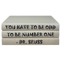 three books stacked on top of each other with the words you have to be odd to be number one and dr seuss