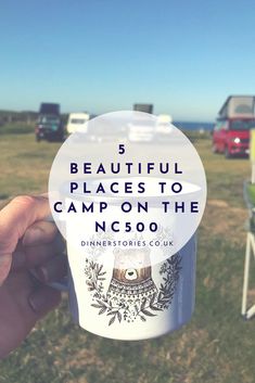 a person holding up a cup with the words beautiful places to camp on the nc900