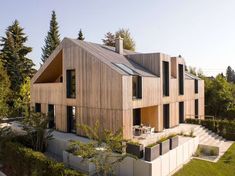 the house is made out of wood and has two levels that are connected to each other