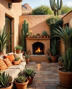 a living room filled with lots of potted plants next to a fire in the fireplace