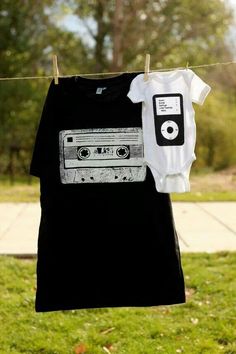 a t - shirt hanging on a clothes line with an old cassette player on it