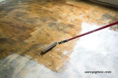 a mop is laying on the floor in an empty room