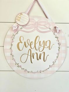 a pink and white sign hanging on the side of a wall with an inscription that says, everyone amn