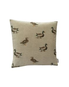 a pillow with ducks on it