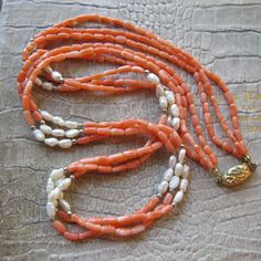 Asian Freshwater Pearls & Coral Bead Necklace, Gilt Vermeil Silver Traditional Asian Chinese Oval Ornate Clasp, 1960's to 1970's Eastern (far) Coral Gem Necklace. Drape or twist for varying style looks. The spacer tiny beads are silver, material unknown.  Length: 25 1/2 IN  Bead Width: Corals 3 MM, Pearls 4 MM, approx, they are longer than wide True Vintage  Condition is overall good, no major issues, original stringing (wear with care), gilt silver aka vermeil, clasp has some gold fade on rever Traditional Luxury Red Coral Beaded Necklaces, Luxury Coral Beaded Necklaces With Round Beads, Vintage Double Strand Gemstone Beads Necklace, Vintage Multi-strand Gemstone Bead Necklaces, Vintage Multi-strand Gemstone Beads Jewelry, Vintage Multi-strand Gemstone Beads Necklace, Vintage Coral Round Bead Jewelry, Vintage Double Strand Gemstone Bead Jewelry, Vintage Double Strand Polished Beads Necklace