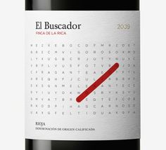 a bottle of red wine with a crossword pattern on the front and back side