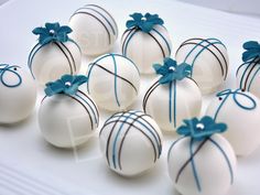 white chocolate candies wrapped in blue ribbon and decorated with bowknoted balls