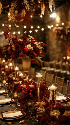 a long table is set with candles, plates and napkins for an elegant dinner