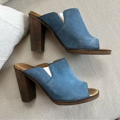 Bought These At A Designer Consignment Store Years Ago And Have Only Worn 3-4 Times So I’m Hoping They Go To A Good Home. Mm6 Sky Blue Wooden Heels. Silver Bottoms, Iconic. 37 Or Us 6.5/7. Heel Height Is 4” And Inside Of Footbed 9 3/4” Inches. Excellent Gently Worn Condition, Not Brand New, Condition Is As Photographed Make An Offer Suede Mules With 4-inch Heel, Blue Spring Mules With Wooden Heel, Blue Mules With Wooden Heel For Spring, Suede Slip-on Heels With Stacked Heel, Blue Open Toe Mules With Wooden Heel, Blue Open Toe Heels With Wooden Heel, Blue Suede Slip-on Mules, Blue Suede Block Heel Shoes, Blue Suede Heels With Block Heel