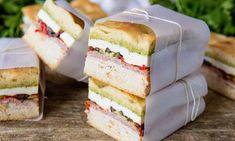 there are four sandwiches stacked on top of each other