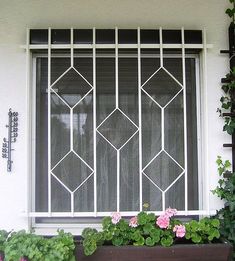 a window that has some flowers in it