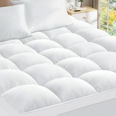 Mattress toppers are used to adda layer of protection, comfort, and softness to enhance the feel of your mattress for a hotel-like experience. The plush down alternative mattress topper can also be used to refresh old mattresses adding a softness while preserving the support of a spring mattress. If youre looking for a hypoallergenic mattress pad with top-of-the-line comfort and optimum thickness that adds a soft pillow top padding, weve got you covered. 8-21 inch elastic deep pocket tightly wra Pillow Top Mattress Pad, Queen Mattress Topper, Feather Bed, Twin Xl Mattress, Mattress Toppers, Spring Mattress, Full Mattress, Pillow Top Mattress, Soft Pillow