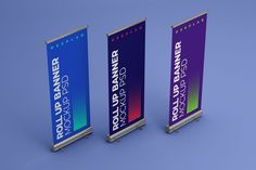 three roll - up banners with the same color and size as they are on display