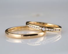 two yellow gold wedding rings with diamonds on white background photo - free image about jewelry