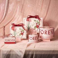 four boxes with flowers on them sitting on a table