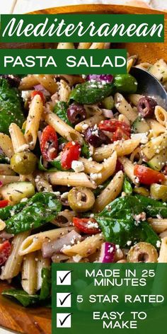 a bowl filled with pasta and vegetables on top of a table