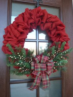 a christmas wreath hanging on the front door