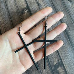 For each ordering, you will receive 1 pair of vampire cross themed earrings measure about 5cm in dimension, made with light weight steel alloy, coated with non-reflective metal ink that gives them the charcoal ink texture. It features elegant details of black cross that dangle towards your shoulder when put on.  This will be a nice halloween accessory, also a perfect fit for your wizardry outfit or gothic style event.  A foldable gift box measures 5 x 5 x 5cm in dimension can be included for you Black Gothic Stainless Steel Earrings, Black Cross-shaped Earrings For Gift, Black Cross Earrings As Gift, Black Cross Earrings For Gift, Black Metal Cross Earrings, Black Cross Metal Earrings, Black Metal Grunge Earrings, Black Gothic Cross Earrings, Black Cross Earrings For Pierced Ears