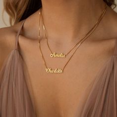 • Material: High-Quality Solid 925 Sterling Silver • Finish: Sterling Silver ∙ 18K Gold ∙ Rose Gold• Dimensions: Depending on your font choice, height sizes range from 3mm to 4mm lowercase SKU: MM-NM92F97 Necklace Name Design, Double Name Necklace, Rose Gold Top, Double Name, Popular Fonts, Necklace Name, Silver Top, Silver Tops, Gold Top