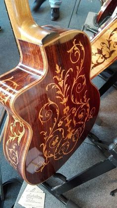 an acoustic guitar is on display in a room