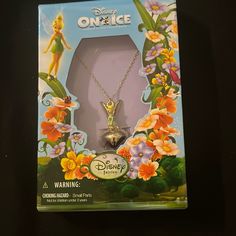 the box has an image of tinkerbell and flowers on it's front