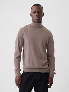 Soft Merino wool turtleneck sweater.  Turtleneck.  Long sleeves.  Responsible Wool Standard certified.  Fit: Classic.  A straight & easy fit.  Hits at the hip.  Models are 6′1″–6′2″ 185 cm–188 cm) with a 31″ 79 cm) waist & 32–33″ 81 cm–84 cm) inseam & are wearing Gap Gap Long Sleeve Sweater With Ribbed Cuffs, Wool Polo Sweater With Funnel Neck For Fall, Wool Funnel Neck Polo Sweater For Fall, Classic Gap Tops For Fall, Classic Turtleneck Sweater For Fall, Solid Turtleneck Polo Sweater For Fall, Fall Solid Turtleneck Polo Sweater, Long Sleeve Merino Wool Turtleneck For Fall, Merino Wool Long Sleeve Turtleneck For Fall