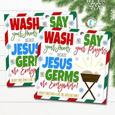 two christmas cards with the words jesus, jesus and germs on them next to a pine tree