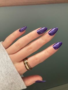 A hand with a ring on the index finger that has dark purple nails Dark Purple Round Nails, Deep Purple Almond Nails, Dark Purple Chrome Nails Almond, Dark Purple Nails For Prom, Dark Purple Almond Acrylic Nails, Pretty Almond Nails Colour, Rounded Summer Nails, Simple Dark Purple Nails