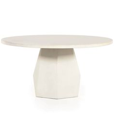 a white table with an oval top and pedestal base on the side, against a white background