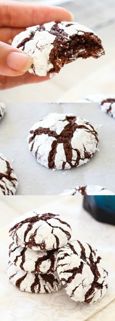 chocolate crinkle cookies with white powdered sugar on top are being held up by someone's hand