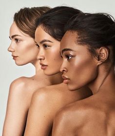 three nude women with their backs turned to the side, all looking in different directions