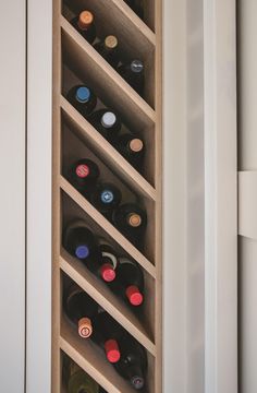 a wine rack with many bottles in it