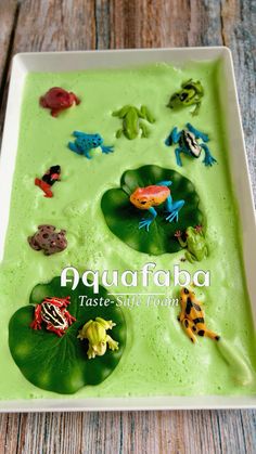 frogs and froggies are in the water on a leafy green substance that's made from fondant