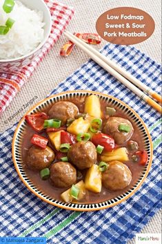 a bowl filled with meatballs and pineapples next to rice