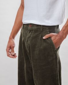 Corduroy pants just never go out of style, they just come back even better! In understated stone green and made from sturdy yet cuddly soft organic cotton corduroy, these pants are just perfect for the colder months. Fair and sustainably produced in Portugal. Baggy Corduroy Pants Men, Loose Corduroy Pants Outfit, Mens Brown Corduroy Pants Outfit, Courderoy Pants Outfits Male, Corderoy Outfits Aesthetic Men, Men’s Corduroy Pants Outfit, Green Curdoroy Pants, Mens Green Pants Outfit, Corduroy Pants Outfit Mens