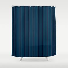 a blue shower curtain with vertical stripes