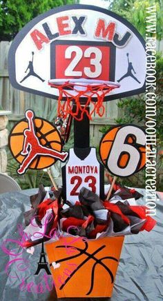 a basketball themed centerpiece is displayed on a table