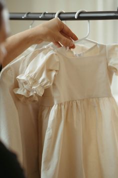 "Introducing our adorable Toddler Girls Dresses! Elevate your little one's style with our charming muslin fabric, linen colored dresses featuring a square neckline and short poof sleeves. Choose to capture those precious moments individually with just the toddler dress or create a matching Mommy & Me set for an extra touch of sweetness. Embrace the quality and cuteness in every stitch - perfect for those special occasions or everyday play! * Handmade in my studio from a muslin fabric blend * Han Homestead Dress, Toddler Modeling, Modest Girl, Baptism Dress, Baby Sewing Patterns, Muslin Fabric, Toddler Girl Dresses, Baby Sewing