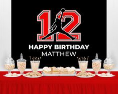 a table topped with lots of desserts and drinks next to a sign that says happy birthday mathew