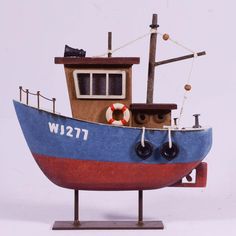 a wooden model of a boat with a life preserver