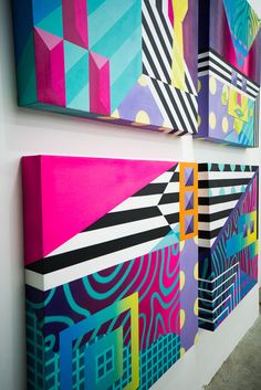 three colorful paintings on the wall next to each other