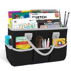 a large black bag filled with lots of school supplies on top of a white background