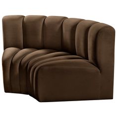 the curved sofa is made from dark brown fabric and has four sections on each side