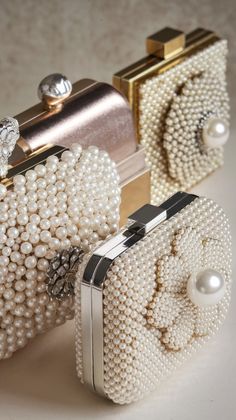 Add a touch of opulence to your wedding day with these luxurious pearl-encrusted clutches. Available in various designs, they make the perfect statement accessory for brides embracing glamour and elegance in 2025.