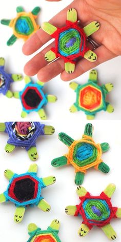 handmade turtle pinatas are being held by someone's fingers