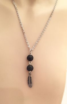 This simple lava stone essential oil diffuser necklace is dainty and perfect for diffusing your favorite oils. Made with two lava stone beads and a feather charm. Apply oil of choice to the lava stone beads and diffuse on the go. Necklace is made with stainless steel chain with lobster claw closure. Please Note, this is not a toy. JustBreatheZen is NOT liable for misuse of diffuser jewelry. This jewelry is intended for external use only. Jewelry not intended for children under 6yrs of age due to Lava Bead Jewelry, Lava Stone Jewelry, Essential Oil Necklace, Lava Stone Necklace, Lava Rock Jewelry, Essential Oil Necklaces, Oil Diffuser Necklace, Essential Oil Necklace Diffuser, Diffuser Jewelry