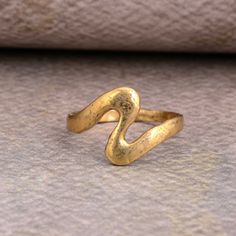 Unique Wave Ring Gold, Womens Oceans Wave Ring, Trendy Ocean Sea Wave Ring Brass, Women's Trendy Waves Brass Band SIZE :- All Size Are Available, choose from variation. METAL :- Brass ❥ Customers satisfaction is our biggest priority, please contact us with any questions/queries for future or existing orders, and we will do our best to make sure you are happy with your order. ♥ Please Make Sure to Include The Correct Address During Before Order. You Can return Item within 30 Days After Successful Hand Forged Rings As Gift, Vintage Metal Toe Ring, Vintage Metal Toe Ring Midi Rings, Vintage Metal Midi Rings As Gift, Vintage Hand Forged Metal Rings, Vintage Handmade Gold Stackable Rings, Handmade Vintage Gold Stackable Rings, Wax Carved Ring, Rings Beach