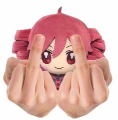 someone is holding their hand up to show the finger sign with an anime character on it